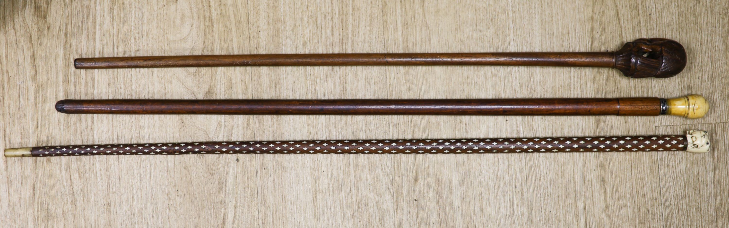 Three various walking canes 93cm